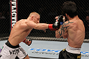 STOCKHOLM, SWEDEN - APRIL 14:  (L-R) Dennis Siver punches Diego Nunes during their featherweight bout at the UFC on Fuel TV event at Ericsson Globe on April 14, 2012 in Stockholm, Sweden.  (Photo by Josh Hedges/Zuffa LLC/Zuffa LLC via Getty Images)