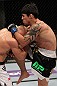STOCKHOLM, SWEDEN - APRIL 14:  (R-L) Diego Nunes delivers a knee strike against Dennis Siver during their featherweight bout at the UFC on Fuel TV event at Ericsson Globe on April 14, 2012 in Stockholm, Sweden.  (Photo by Josh Hedges/Zuffa LLC/Zuffa LLC via Getty Images)