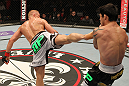 STOCKHOLM, SWEDEN - APRIL 14:  (L-R) Dennis Siver kicks Diego Nunes during their featherweight bout at the UFC on Fuel TV event at Ericsson Globe on April 14, 2012 in Stockholm, Sweden.  (Photo by Josh Hedges/Zuffa LLC/Zuffa LLC via Getty Images)