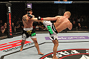 STOCKHOLM, SWEDEN - APRIL 14:  (R-L) Dennis Siver kicks Diego Nunes during their featherweight bout at the UFC on Fuel TV event at Ericsson Globe on April 14, 2012 in Stockholm, Sweden.  (Photo by Josh Hedges/Zuffa LLC/Zuffa LLC via Getty Images)