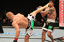 STOCKHOLM, SWEDEN - APRIL 14:  (L-R) Dennis Siver kicks Diego Nunes during their featherweight bout at the UFC on Fuel TV event at Ericsson Globe on April 14, 2012 in Stockholm, Sweden.  (Photo by Josh Hedges/Zuffa LLC/Zuffa LLC via Getty Images)