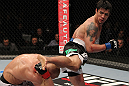 STOCKHOLM, SWEDEN - APRIL 14:  (R-L) Diego Nunes kicks Dennis Siver during their featherweight bout at the UFC on Fuel TV event at Ericsson Globe on April 14, 2012 in Stockholm, Sweden.  (Photo by Josh Hedges/Zuffa LLC/Zuffa LLC via Getty Images)