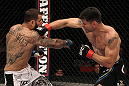 STOCKHOLM, SWEDEN - APRIL 14:  (R-L) Brian Stann punches Alessio Sakara during their middleweight bout at the UFC on Fuel TV event at Ericsson Globe on April 14, 2012 in Stockholm, Sweden.  (Photo by Josh Hedges/Zuffa LLC/Zuffa LLC via Getty Images)