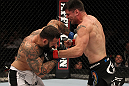 STOCKHOLM, SWEDEN - APRIL 14:  (R-L) Brian Stann and Alessio Sakara trade punches during their middleweight bout at the UFC on Fuel TV event at Ericsson Globe on April 14, 2012 in Stockholm, Sweden.  (Photo by Josh Hedges/Zuffa LLC/Zuffa LLC via Getty Images)