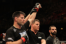 STOCKHOLM, SWEDEN - APRIL 14:  Brian Stann (L) reacts after defeating Alessio Sakara (R) by TKO in a middleweight bout at the UFC on Fuel TV event at Ericsson Globe on April 14, 2012 in Stockholm, Sweden.  (Photo by Josh Hedges/Zuffa LLC/Zuffa LLC via Getty Images)