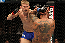 STOCKHOLM, SWEDEN - APRIL 14:  (L-R) Alexander Gustafsson punches Thiago Silva during their light heavyweight bout at the UFC on Fuel TV event at Ericsson Globe on April 14, 2012 in Stockholm, Sweden.  (Photo by Josh Hedges/Zuffa LLC/Zuffa LLC via Getty Images)