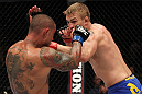STOCKHOLM, SWEDEN - APRIL 14:  (R-L) Alexander Gustafsson punches Thiago Silva during their light heavyweight bout at the UFC on Fuel TV event at Ericsson Globe on April 14, 2012 in Stockholm, Sweden.  (Photo by Josh Hedges/Zuffa LLC/Zuffa LLC via Getty Images)