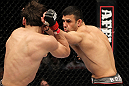 STOCKHOLM, SWEDEN - APRIL 14:  (R-L) Besam Yousef punches Simeon Thoresen during their welterweight bout at the UFC on Fuel TV event at Ericsson Globe on April 14, 2012 in Stockholm, Sweden.  (Photo by Josh Hedges/Zuffa LLC/Zuffa LLC via Getty Images)