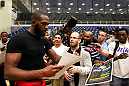 ATLANTA, GA - APRIL 19:  Jon Jones signs autographs for fans after working out for the media during UFC 145 open workouts at GSU Sports Arena on April 19, 2012 in Atlanta, Georgia.  (Photo by Kevin C. Cox/Zuffa LLC/Zuffa LLC via Getty Images)