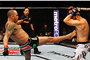 ATLANTA, GA - APRIL 21:  Travis Browne (L) kicks Chad Griggs during their heavyweight bout for UFC 145 at Philips Arena on April 21, 2012 in Atlanta, Georgia.  (Photo by Al Bello/Zuffa LLC/Zuffa LLC via Getty Images)