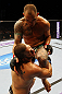 ATLANTA, GA - APRIL 21:  Travis Browne (back) lands a knee on Chad Griggs during their heavyweight bout for UFC 145 at Philips Arena on April 21, 2012 in Atlanta, Georgia.  (Photo by Al Bello/Zuffa LLC/Zuffa LLC via Getty Images)