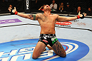 ATLANTA, GA - APRIL 21:  Travis Browne celebrates defeating Chad Griggs by tap out from an arm triangle during their heavyweight bout for UFC 145 at Philips Arena on April 21, 2012 in Atlanta, Georgia.  (Photo by Al Bello/Zuffa LLC/Zuffa LLC via Getty Images)