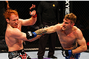 ATLANTA, GA - APRIL 21:  John Alessio (R) punches Mark Bocek during their lightweight bout for UFC 145 at Philips Arena on April 21, 2012 in Atlanta, Georgia.  (Photo by Al Bello/Zuffa LLC/Zuffa LLC via Getty Images)