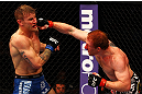 ATLANTA, GA - APRIL 21:  Mark Bocek (R) punches John Alessio during their lightweight bout for UFC 145 at Philips Arena on April 21, 2012 in Atlanta, Georgia.  (Photo by Al Bello/Zuffa LLC/Zuffa LLC via Getty Images)