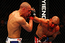 ATLANTA, GA - APRIL 21:  Eddie Yagin (R) punches Mark Hominick during their featherweight bout for UFC 145 at Philips Arena on April 21, 2012 in Atlanta, Georgia.  (Photo by Al Bello/Zuffa LLC/Zuffa LLC via Getty Images)