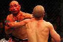 ATLANTA, GA - APRIL 21:  Eddie Yagin (L) punches Mark Hominick during their featherweight bout for UFC 145 at Philips Arena on April 21, 2012 in Atlanta, Georgia.  (Photo by Al Bello/Zuffa LLC/Zuffa LLC via Getty Images)