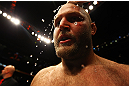 ATLANTA, GA - APRIL 21:  Water is applied to Ben Rothwell's head after he defeated Brendan Schaub by TKO in the first round of their heavyweight bout for UFC 145 at Philips Arena on April 21, 2012 in Atlanta, Georgia.  (Photo by Al Bello/Zuffa LLC/Zuffa LLC via Getty Images)