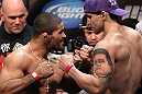 EAST RUTHERFORD, NJ - MAY 04:  (L-R) Middleweight opponents Rousimar Palhares and Alan Belcher face off after weighing in during the UFC on FOX official weigh in at Izod Center on May 4, 2012 in East Rutherford, New Jersey.  (Photo by Josh Hedges/Zuffa LLC/Zuffa LLC via Getty Images)
