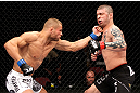 EAST RUTHERFORD, NJ - MAY 05:  Karlos Vemola punches Mike Massenzio during thier Middleweight bout at Izod Center on May 5, 2012 in East Rutherford, New Jersey.  (Photo by Josh Hedges/Zuffa LLC/Zuffa LLC via Getty Images)