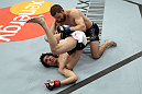 EAST RUTHERFORD, NJ - MAY 05:  Nick Denis slams Roland Delorme to the ground during thier Bantamweight bout at Izod Center on May 5, 2012 in East Rutherford, New Jersey.  (Photo by Josh Hedges/Zuffa LLC/Zuffa LLC via Getty Images)