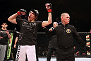 EAST RUTHERFORD, NJ - MAY 05:  Roland Delorme (L) celebrates after defeating Nick Denis in thier Bantamweight bout at Izod Center on May 5, 2012 in East Rutherford, New Jersey.  (Photo by Josh Hedges/Zuffa LLC/Zuffa LLC via Getty Images)