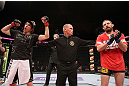 EAST RUTHERFORD, NJ - MAY 05:  Roland Delorme (L) celebrates after defeating Nick Denis in thier Bantamweight bout at Izod Center on May 5, 2012 in East Rutherford, New Jersey.  (Photo by Josh Hedges/Zuffa LLC/Zuffa LLC via Getty Images)
