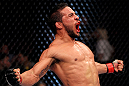 EAST RUTHERFORD, NJ - MAY 05:  Dennis Bermudez celebrates after defeating Pablo Garza in thier Bantamweight bout at Izod Center on May 5, 2012 in East Rutherford, New Jersey.  (Photo by Josh Hedges/Zuffa LLC/Zuffa LLC via Getty Images)