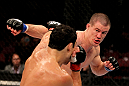 EAST RUTHERFORD, NJ - MAY 05: John Cholish (R) punches Danny Castillo during thier Lightweight bout at Izod Center on May 5, 2012 in East Rutherford, New Jersey.  (Photo by Josh Hedges/Zuffa LLC/Zuffa LLC via Getty Images)