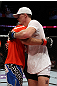 EAST RUTHERFORD, NJ - MAY 05:  Danny Castillo (L) hugs John Cholish (R) after thier Lightweight bout at Izod Center on May 5, 2012 in East Rutherford, New Jersey.  (Photo by Josh Hedges/Zuffa LLC/Zuffa LLC via Getty Images)