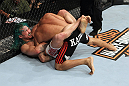 EAST RUTHERFORD, NJ - MAY 05:  Louis Gaudinot chokes out John Lineker to defeat him in thier Flyweight bout at Izod Center on May 5, 2012 in East Rutherford, New Jersey.  (Photo by Josh Hedges/Zuffa LLC/Zuffa LLC via Getty Images)