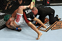 EAST RUTHERFORD, NJ - MAY 05:  Louis Gaudinot chokes out John Lineker to defeat him in thier Flyweight bout at Izod Center on May 5, 2012 in East Rutherford, New Jersey.  (Photo by Josh Hedges/Zuffa LLC/Zuffa LLC via Getty Images)