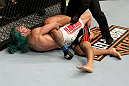 EAST RUTHERFORD, NJ - MAY 05:  Louis Gaudinot chokes out John Lineker to defeat him in thier Flyweight bout at Izod Center on May 5, 2012 in East Rutherford, New Jersey.  (Photo by Josh Hedges/Zuffa LLC/Zuffa LLC via Getty Images)