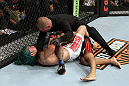 EAST RUTHERFORD, NJ - MAY 05:  Louis Gaudinot chokes out John Lineker to defeat him in thier Flyweight bout at Izod Center on May 5, 2012 in East Rutherford, New Jersey.  (Photo by Josh Hedges/Zuffa LLC/Zuffa LLC via Getty Images)