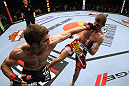 EAST RUTHERFORD, NJ - MAY 05:  John Hathaway (L) punches Pascal Krauss (R) in the face during thier Welterweight bout at Izod Center on May 5, 2012 in East Rutherford, New Jersey.  (Photo by Josh Hedges/Zuffa LLC/Zuffa LLC via Getty Images)