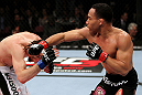 EAST RUTHERFORD, NJ - MAY 05:  John Dodson (R) punches Timothy Elliott (L) during thier Flyweight bout at Izod Center on May 5, 2012 in East Rutherford, New Jersey.  (Photo by Josh Hedges/Zuffa LLC/Zuffa LLC via Getty Images)