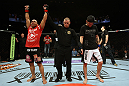 EAST RUTHERFORD, NJ - MAY 05:  John Dodson (L) celebrates after defeating Timothy Elliott (R) during thier Flyweight bout at Izod Center on May 5, 2012 in East Rutherford, New Jersey.  (Photo by Josh Hedges/Zuffa LLC/Zuffa LLC via Getty Images)