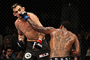 EAST RUTHERFORD, NJ - MAY 05:  Michael Johnson punches Tony Ferguson during thier Flyweight bout at Izod Center on May 5, 2012 in East Rutherford, New Jersey.  (Photo by Josh Hedges/Zuffa LLC/Zuffa LLC via Getty Images)