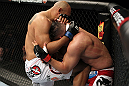 EAST RUTHERFORD, NJ - MAY 05:  Lavar Johnson (L) knees Pat Barry (R) during thier Heavyweight bout at Izod Center on May 5, 2012 in East Rutherford, New Jersey.  (Photo by Josh Hedges/Zuffa LLC/Zuffa LLC via Getty Images)