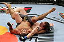 EAST RUTHERFORD, NJ - MAY 05:  Alan Belcher (R) wrestles Rousimar Palhares (L) to the ground during thier Middleweight bout at Izod Center on May 5, 2012 in East Rutherford, New Jersey.  (Photo by Josh Hedges/Zuffa LLC/Zuffa LLC via Getty Images)