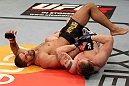 EAST RUTHERFORD, NJ - MAY 05:  Alan Belcher (R) wrestles Rousimar Palhares (L) to the ground during thier Middleweight bout at Izod Center on May 5, 2012 in East Rutherford, New Jersey.  (Photo by Josh Hedges/Zuffa LLC/Zuffa LLC via Getty Images)