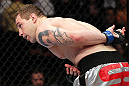 EAST RUTHERFORD, NJ - MAY 05:  Alan Belcher bows to the crowd after defeating Rousimar Palhares in thier Middleweight bout at Izod Center on May 5, 2012 in East Rutherford, New Jersey.  (Photo by Josh Hedges/Zuffa LLC/Zuffa LLC via Getty Images)