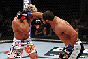 EAST RUTHERFORD, NJ - MAY 05:  Johny Hendricks (R) punches Josh Koscheck (L) during thier Welterweight bout at Izod Center on May 5, 2012 in East Rutherford, New Jersey.  (Photo by Josh Hedges/Zuffa LLC/Zuffa LLC via Getty Images)