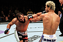 EAST RUTHERFORD, NJ - MAY 05:  Johny Hendricks (L) punches Josh Koscheck (R) during thier Welterweight bout at Izod Center on May 5, 2012 in East Rutherford, New Jersey.  (Photo by Josh Hedges/Zuffa LLC/Zuffa LLC via Getty Images)