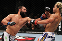 EAST RUTHERFORD, NJ - MAY 05:  Johny Hendricks (L) punches Josh Koscheck (R) during thier Welterweight bout at Izod Center on May 5, 2012 in East Rutherford, New Jersey.  (Photo by Josh Hedges/Zuffa LLC/Zuffa LLC via Getty Images)