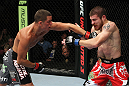 EAST RUTHERFORD, NJ - MAY 05:  Nate Diaz (L) punches Jim Miller (R) during thier Lightweight bout at Izod Center on May 5, 2012 in East Rutherford, New Jersey.  (Photo by Josh Hedges/Zuffa LLC/Zuffa LLC via Getty Images)