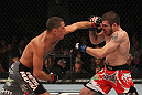 EAST RUTHERFORD, NJ - MAY 05:  Nate Diaz (L) punches Jim Miller (R) during thier Lightweight bout at Izod Center on May 5, 2012 in East Rutherford, New Jersey.  (Photo by Josh Hedges/Zuffa LLC/Zuffa LLC via Getty Images)