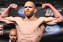 FAIRFAX, VA - MAY 14:  TJ Grant makes weight during the UFC on Fuel TV official weigh in at Patriot Center on May 14, 2012 in Fairfax, Virginia.  (Photo by Josh Hedges/Zuffa LLC/Zuffa LLC via Getty Images)
