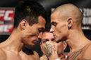 FAIRFAX, VA - MAY 14:  (L-R) Featherweight opponents "The Korean Zombie" Chan Sung Jung and Dustin Poirier face off after weighing in during the UFC on Fuel TV official weigh in at Patriot Center on May 14, 2012 in Fairfax, Virginia.  (Photo by Josh Hedges/Zuffa LLC/Zuffa LLC via Getty Images)