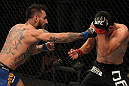 FAIRFAX, VA - MAY 15:  (L-R) Francisco Rivera punches Alex Soto in a bantamweight bout during the UFC on Fuel TV event at Patriot Center on May 15, 2012 in Fairfax, Virginia.  (Photo by Josh Hedges/Zuffa LLC/Zuffa LLC via Getty Images)