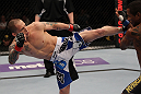 FAIRFAX, VA - MAY 15:  (L-R) Jeff Curran kicks Johnny Eduardo in a bantamweight bout during the UFC on Fuel TV event at Patriot Center on May 15, 2012 in Fairfax, Virginia.  (Photo by Josh Hedges/Zuffa LLC/Zuffa LLC via Getty Images)